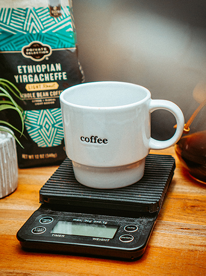 a coffee cup on scales with  ethiopian coffee