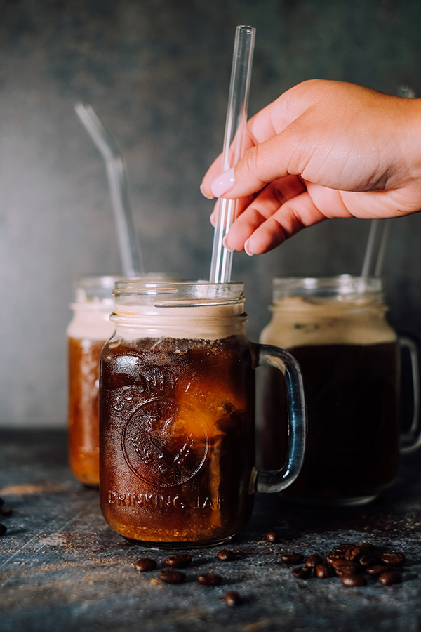 cold brew coffee in a glass with a straw