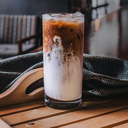 cold brew coffee with ice and milk in a glass
