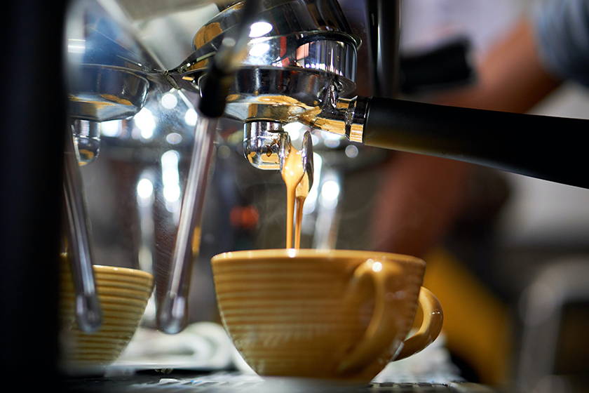 preparing coffee on an espresso machine